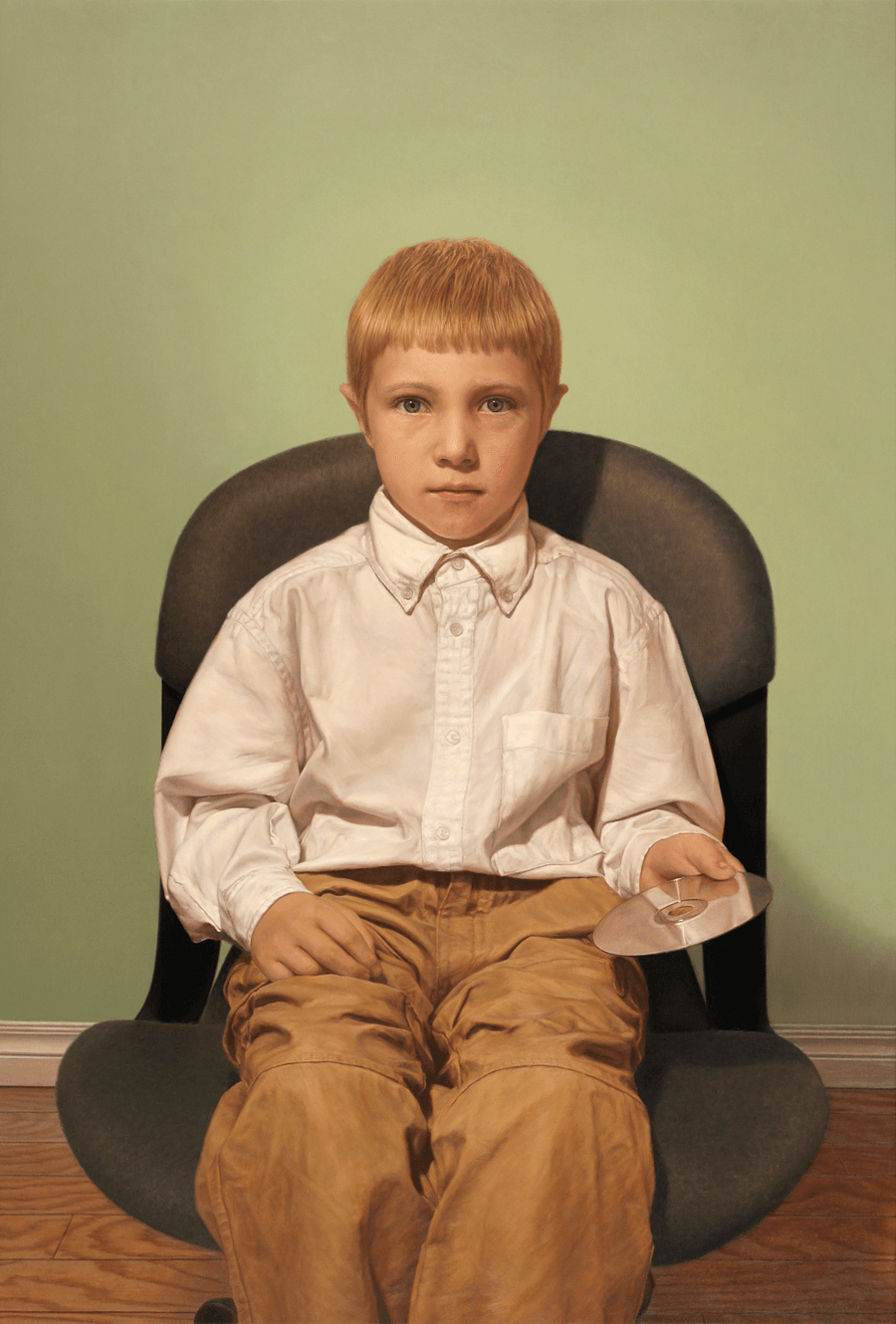 A realist figurative oil painting on panel titled 'Boy with a CD,' measuring 37 3/4 inches by 25 1/2 inches. A young boy with light brown hair sits in a dark, upholstered computer chair, his head is fixed forward as he holds a reflective silver compact disc carefully in his hand. He wears an oversized white shirt. The background is a luminescent softly lit green lit stark interior. Soft, directional light from the left highlights his facial features and the reflective surface of the disc, casting gentle shadows across the chair. Oil painting by John Hansen.