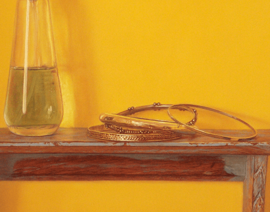 A detailed close-up from the oil painting 'Bracelets on Shelf.' This view highlights the intricate textures of the braided metal bracelets, showcasing the fine brushwork used to render the reflective quality of silver and gold and the transparent effects within the perfume bottle. The sharp highlights and glowing shadows emphasize the three-dimensional form of the jewellery sitting upon the reflective wood. Oil painting by John Hansen.