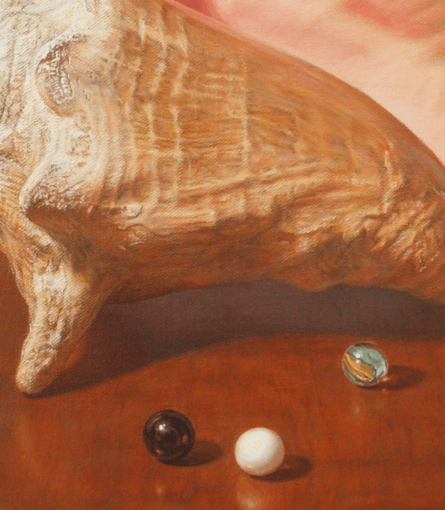 A detailed close-up from the oil painting 'Conch Shell'. This view highlights the lower section of the composition, focusing on the three glass marbles and the curling green ribbon resting on the stained wood. The clarity of the brushwork is evident in the sharp reflections of the marbles and the subtle sheen of the ribbon against the polished table surface. Oil painting by John Hansen.