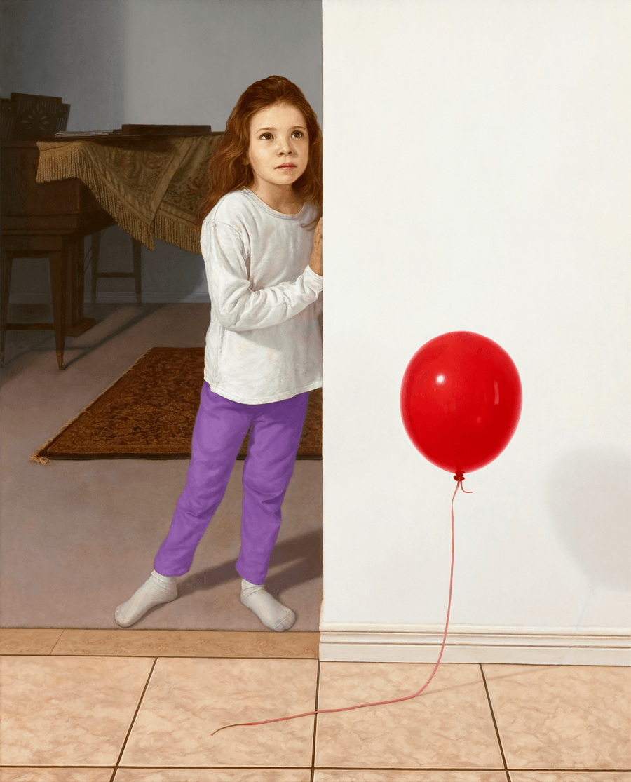 A realist oil painting on panel titled 'Girl with a Balloon,' measuring 35 inches by 28 1/4 inches. A young girl with long, wavy reddish-blonde hair is standing at the entrance to a darker front room. She is looking slightly upward at possibly a parent while a vibrant red balloon floats in mid air in the adjoining hallway. Her face and posture captures a quiet, thoughtful expression. To the left, an interior light provides soft, cool light that illuminates her face and the side of the balloon, other lighting is evident in the balloon's highlights, creating a sharp highlight against the dark, shadowy interior background. Oil painting by John Hansen.