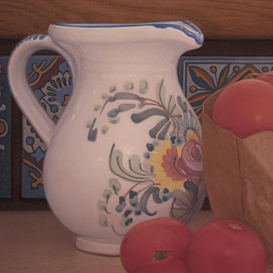 Close-up detail of the oil painting 'Tomatoes and Floral Pitcher.' This view highlights the smooth, glazed surface of the white pitcher’s handle and the fine brushwork used to create its floral patterns. The saturated red of the tomatoes contrasts with the intricate geometric designs of the decorative blue tiles behind them, showcasing the interplay of organic and man-made textures. Oil painting by John Hansen.